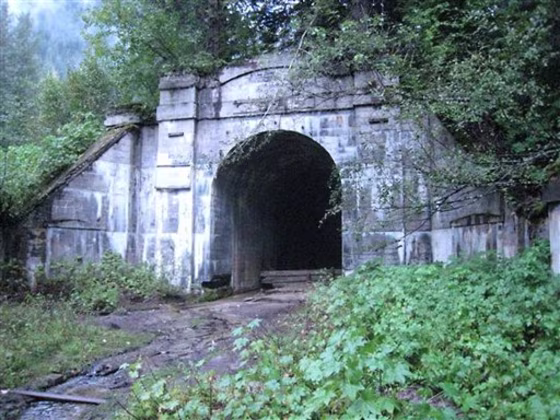 The western portal of the long-abandoned Great Northern Railway tunnel beneath Stevens Pass, Wash., is shown. The tunnel ends at what was once the railroad town of Wellington, Wash., where the nation's worst avalanche disaster occurred 100 years ago, when two passenger trains were swept away by a snow slide, killing nearly 100 people.